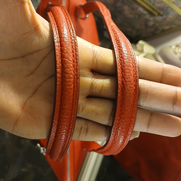 Coach Tyler Tote in an orange/red shade of pebbled leather. - Picture 6 of 16